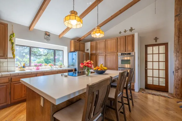 a living room with furniture rug and window