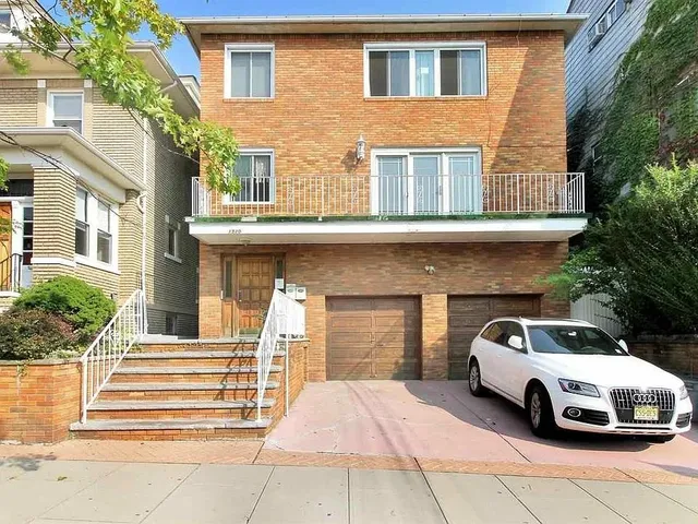 a view of a car parked in front of house