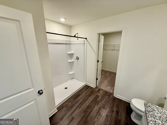 a view of a room with racks on the wall