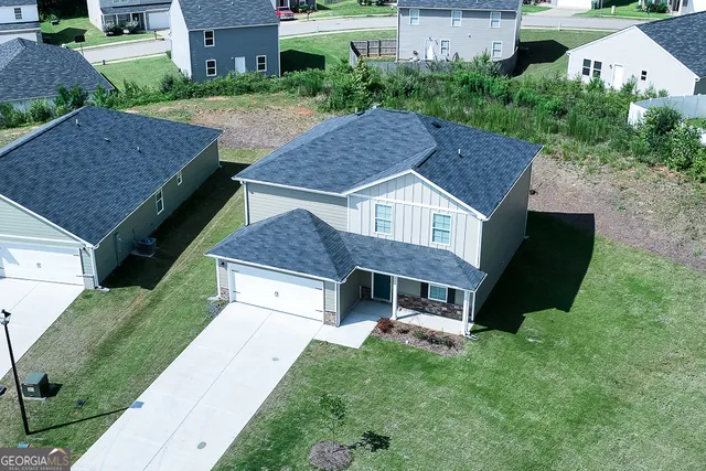 an aerial view of a house with a garden