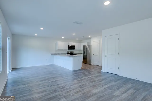 a view of kitchen with wooden floor