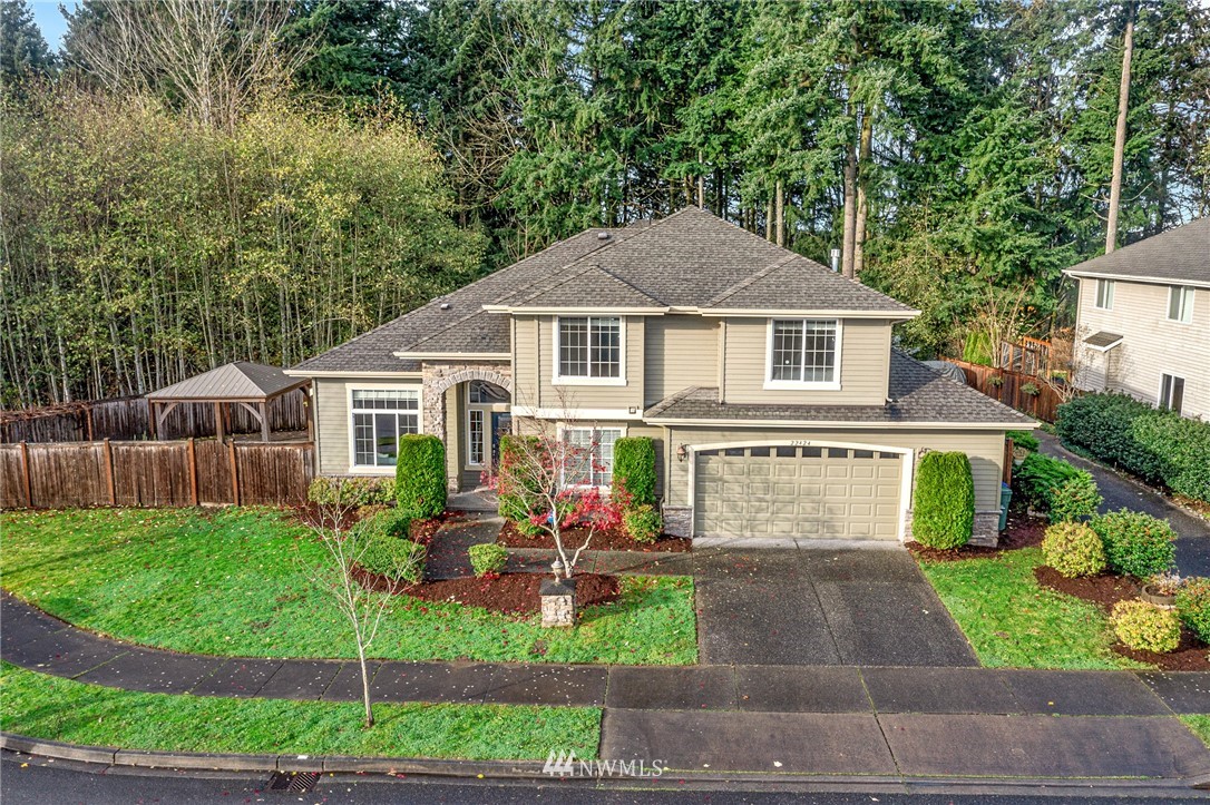 22424 6th Place West Bothell, WA 98021 - Photo 1 of 31 a front view of a house with garden