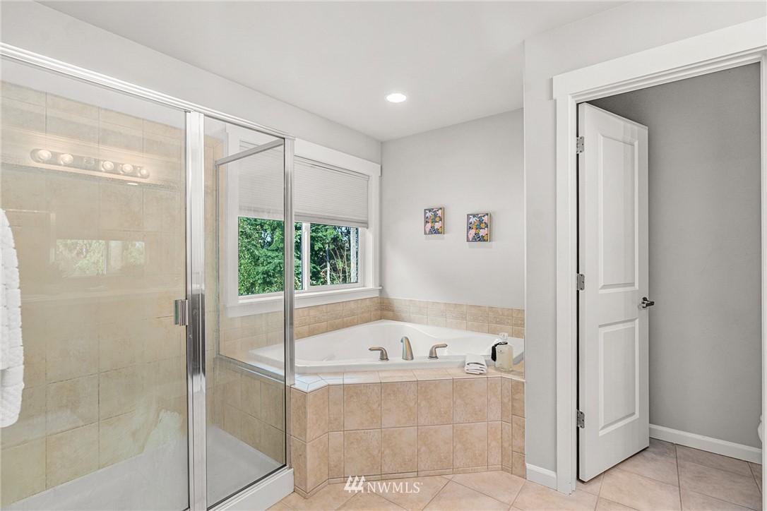 22424 6th Place West Bothell, WA 98021 - Photo 22 of 31 a bathroom with a tub and shower