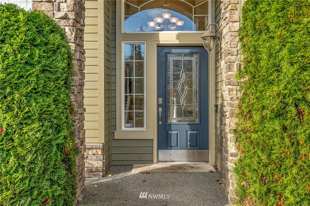 22424 6th Place West Bothell, WA 98021 - Photo 29 of 31 a view of a brick house with a large windows and a large tree