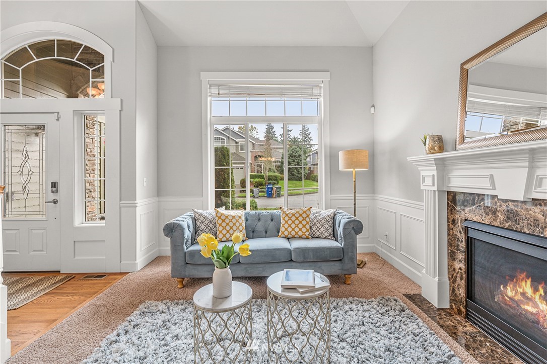 22424 6th Place West Bothell, WA 98021 - Photo 6 of 31 a living room with furniture windows and a fireplace