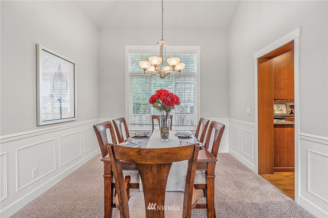 22424 6th Place West Bothell, WA 98021 - Photo 8 of 31 a dining room with furniture a livingroom and chandelier