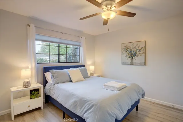 a bedroom with a large bed and a window