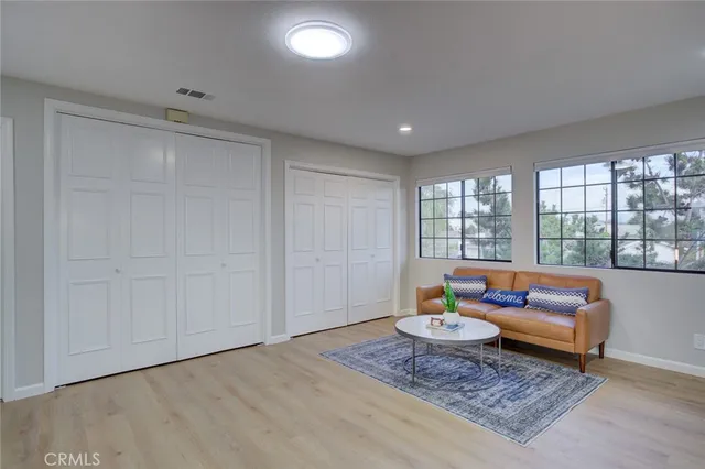 a living room with furniture and a rug