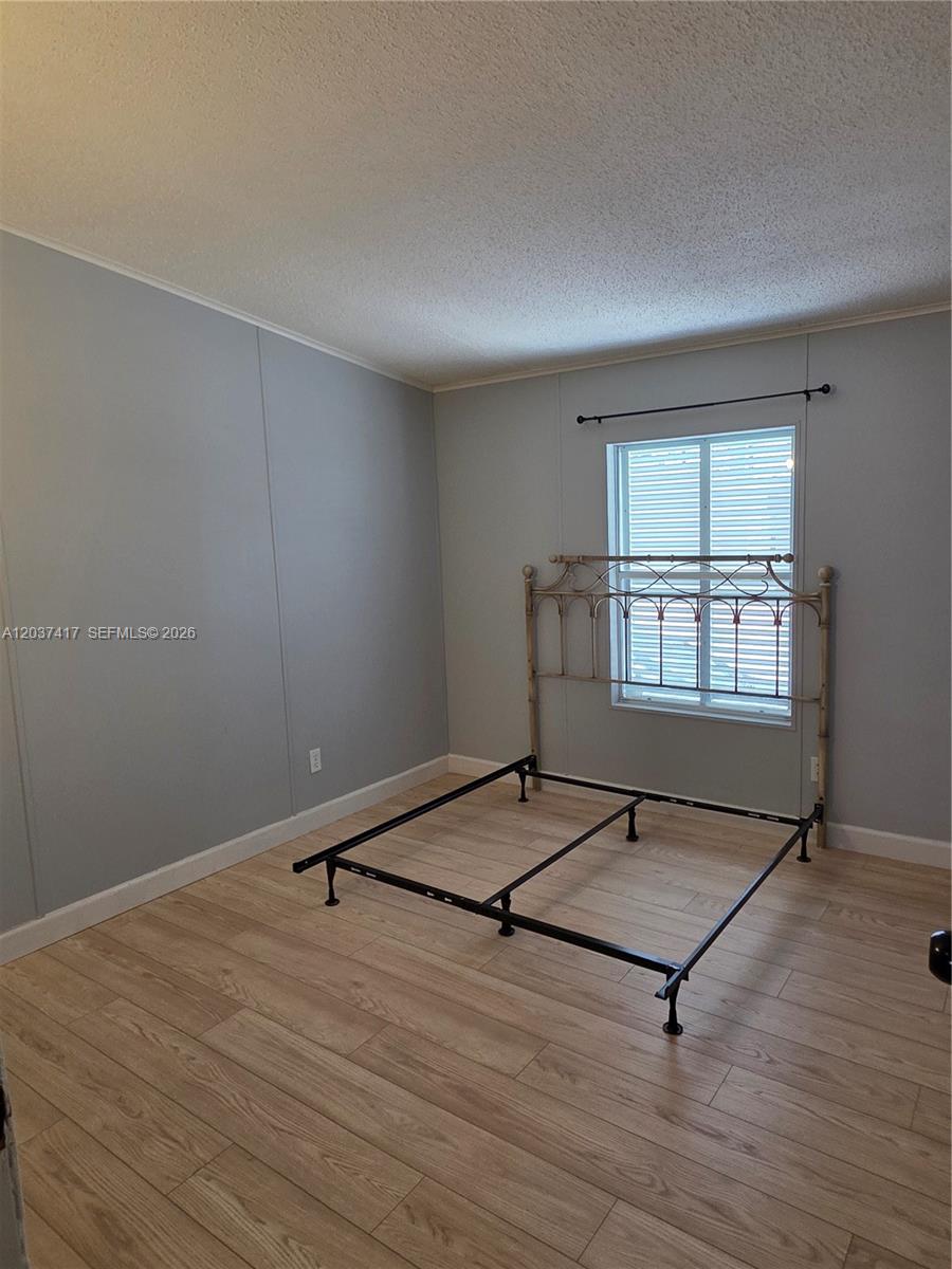 17350 Southwest 232nd Street, Unit 47 Miami, FL 33170 - Photo 4 of 9 wooden floor and windows in a room
