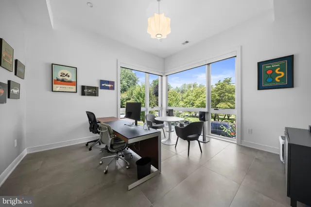 a spacious bedroom with a bed and a table in it