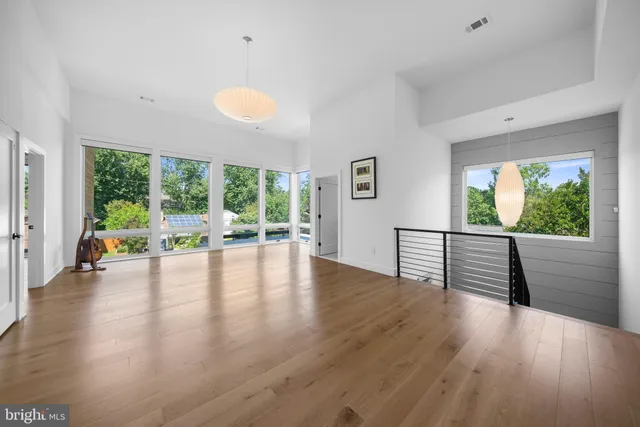 a spacious bedroom with a bed and a couch