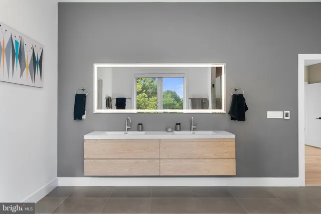 a view of walk in closet with wooden floor and stairs