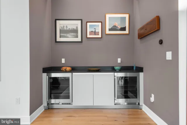 a view of cabinets and painting on the wall