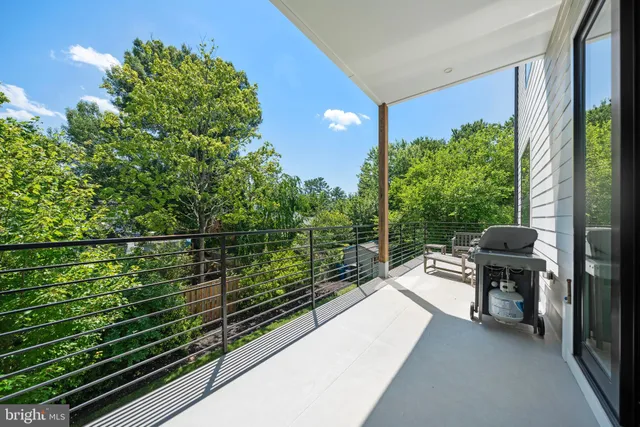 an empty room with closet and wooden door