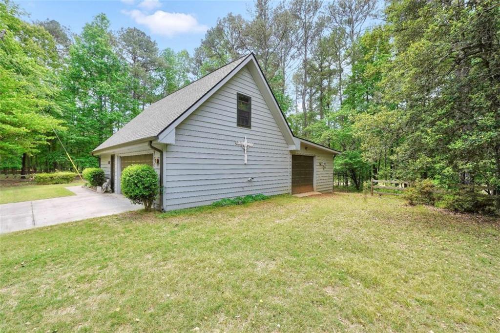 314 Winding Stream Trail Southwest Conyers, GA 30094 - Photo 54 of 59 a view of a house with backyard and garden