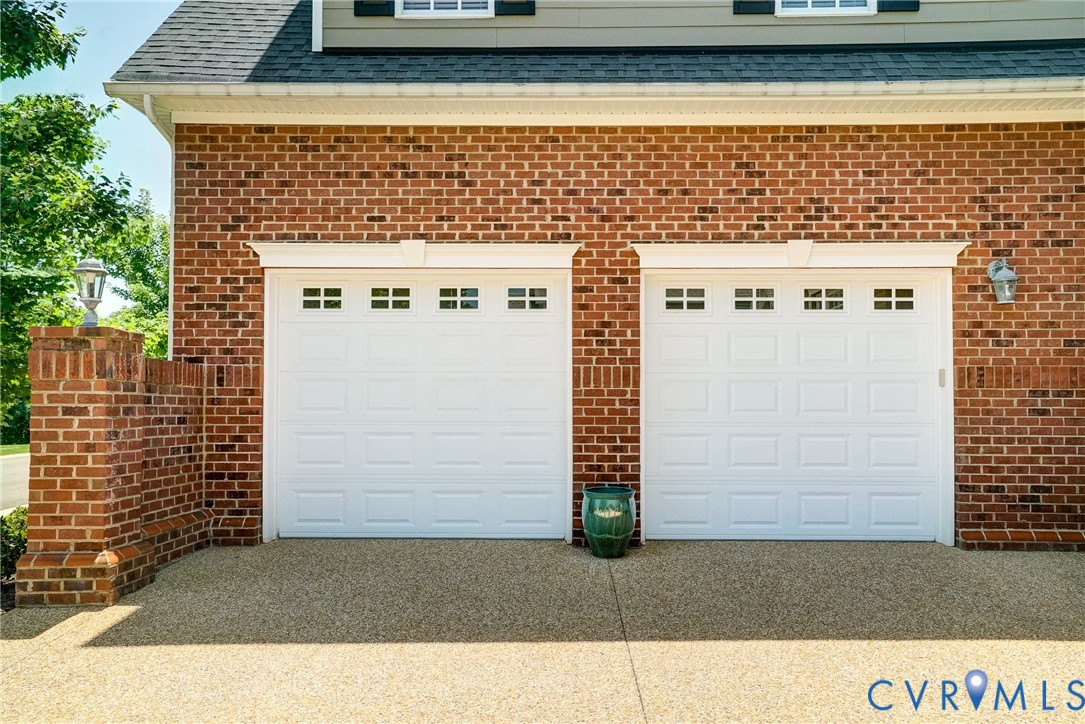 3606 Edenfield Road Midlothian, VA 23113 - Photo 4 of 67 Two white paneled garage doors featuring window in