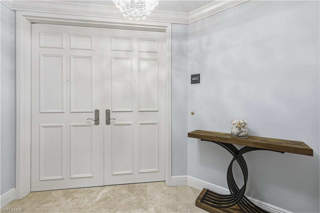 275 Indies Way, Unit 403 Naples, FL 34110 - Photo 3 of 50 a bathroom with a sink