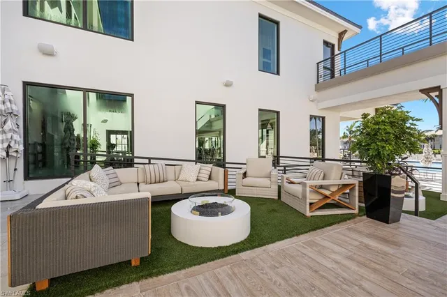 a view of a house with outdoor space and sitting area
