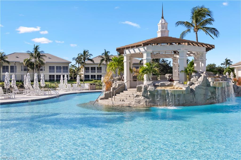 275 Indies Way, Unit 403 Naples, FL 34110 - Photo 44 of 50 a view of a house with outdoor space and sitting area