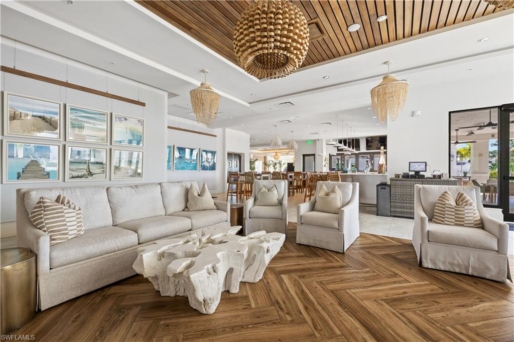 275 Indies Way, Unit 403 Naples, FL 34110 - Photo 49 of 50 a living room with furniture or couch and a table