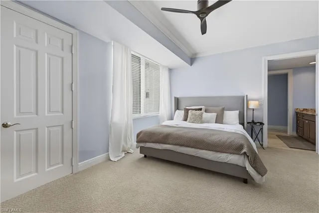 a bedroom with a bed and a lamp