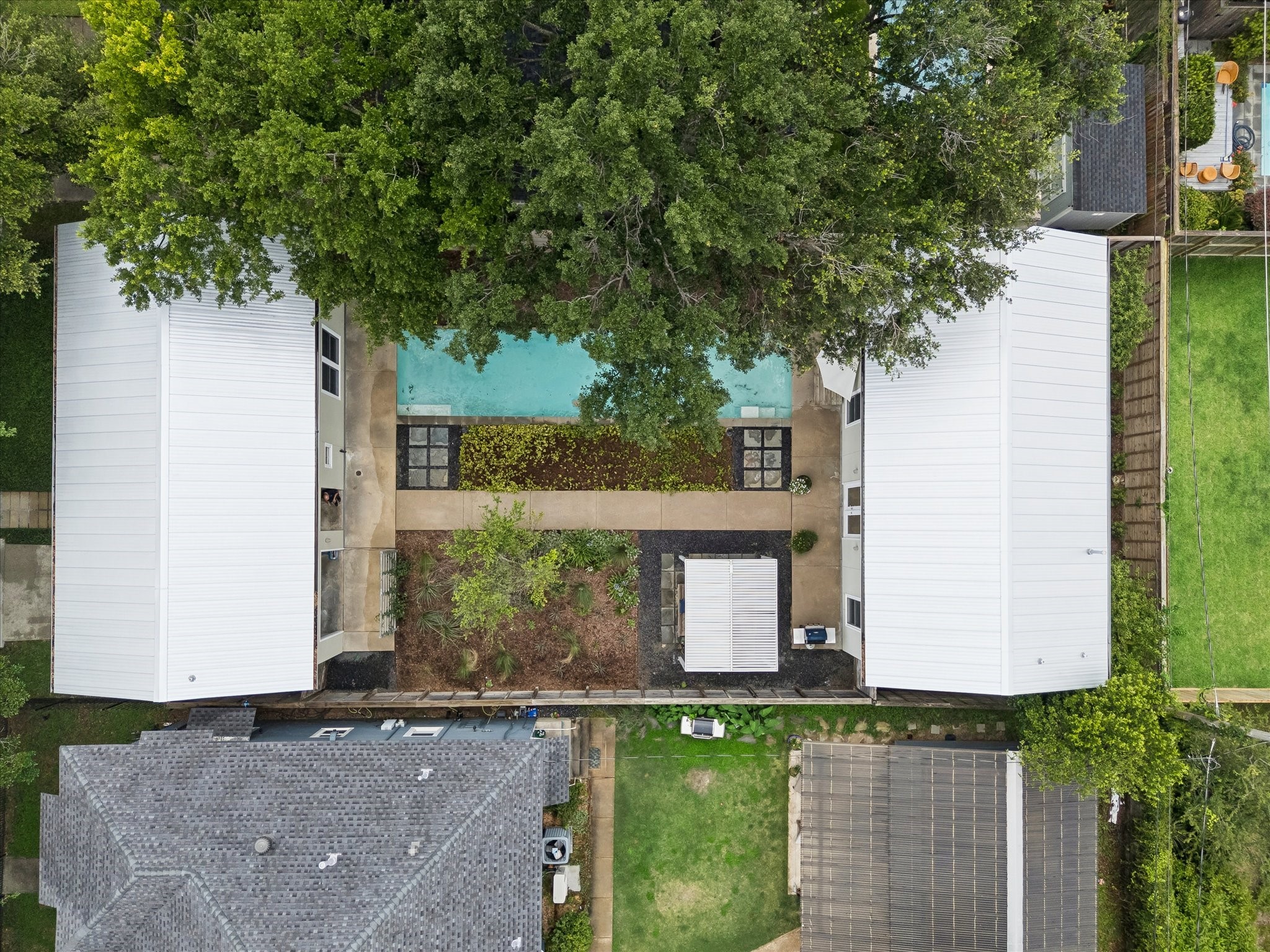 1418 Kipling Street Houston, TX 77006 - Photo 39 of 42 Aerial view of home showing the true simplicity of the design of the home and how each side relates to the whole.