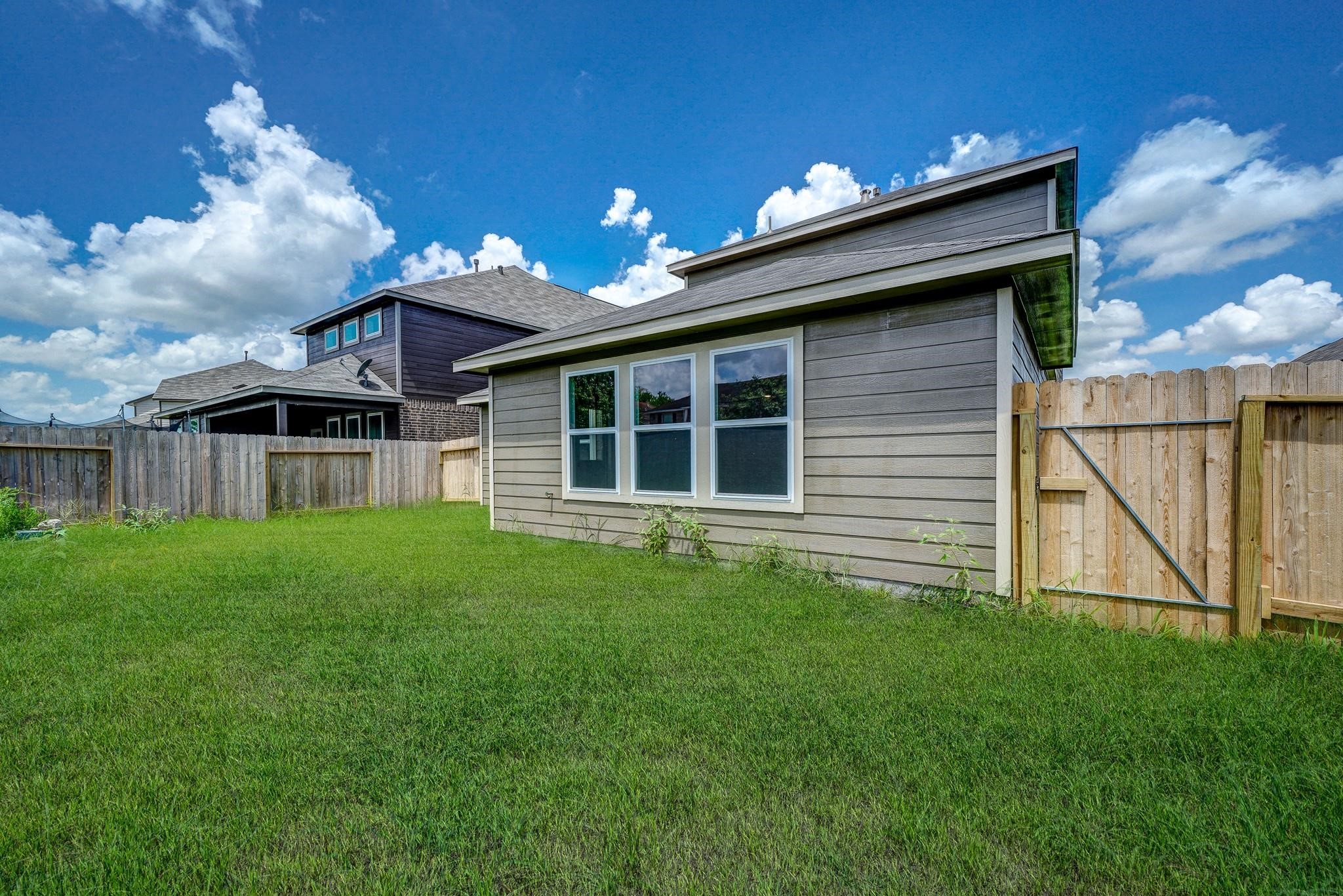 1015 Willowick Road Houston, TX 77090 - Photo 38 of 42 Well-maintained backyard, ideal for pets to run and play!