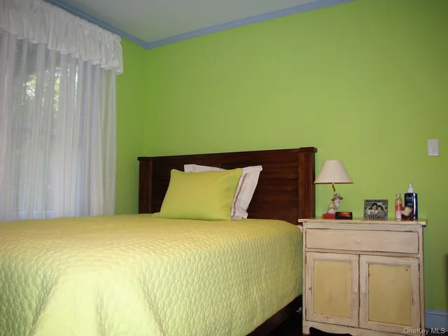 a bedroom with a bed and cabinets