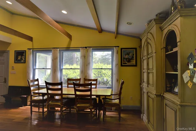 a view of a dining room with furniture window and outside view