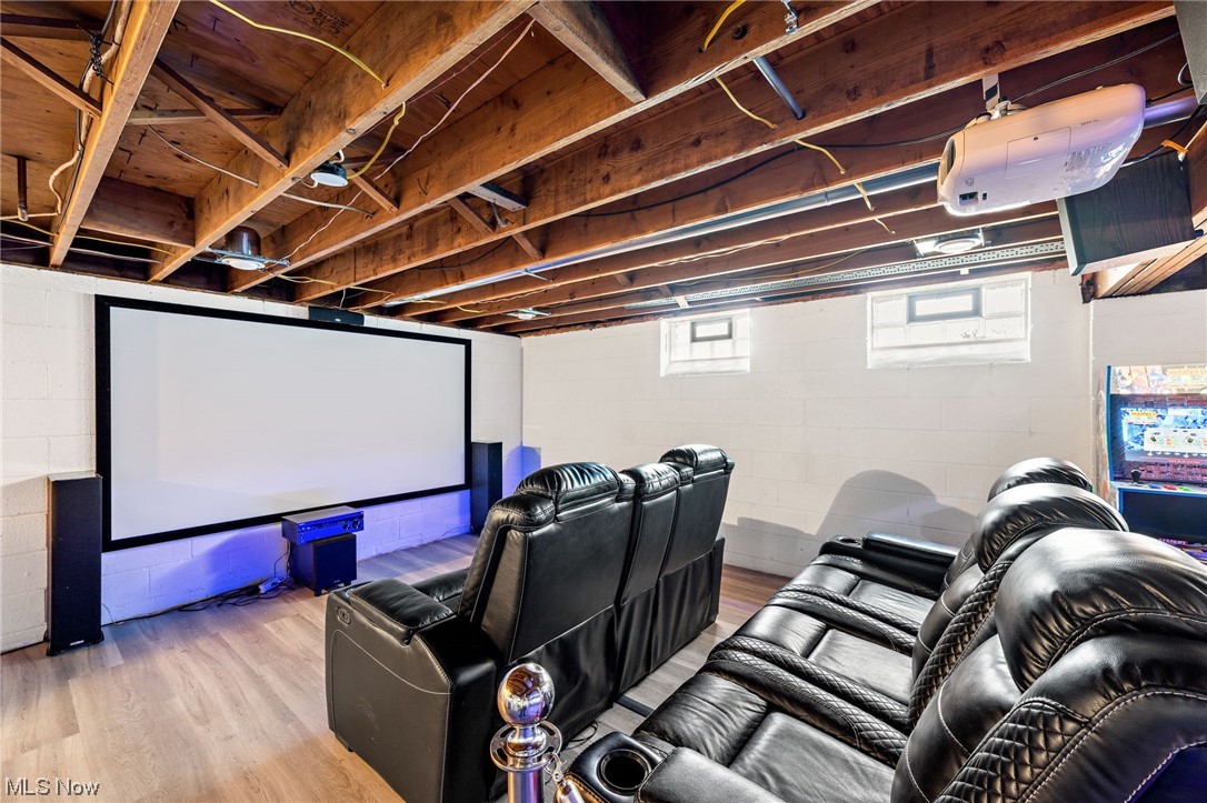 2425 McMackin Road Madison, OH 44057 - Photo 36 of 46 Home theater room featuring light hardwood / wood-style floors