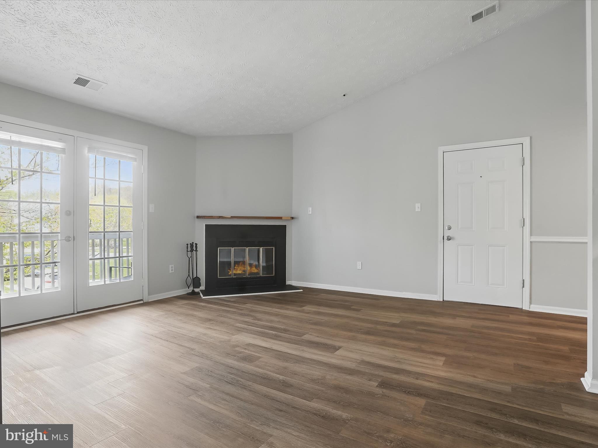 6435 Greenfield Road, Unit 1210 Elkridge, MD 21075 - Photo 8 of 30 Living Room - Fireplace - Balcony
