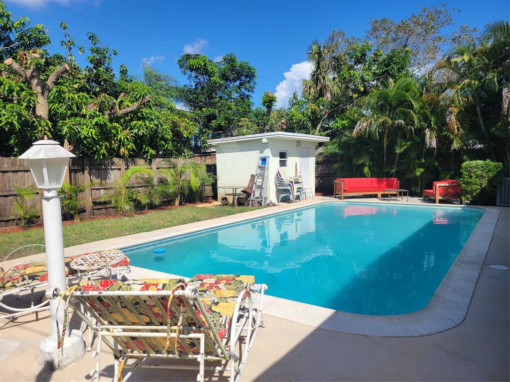 6151 Southwest 2nd Street Margate, FL 33068 - Photo 2 of 4 a view of a chairs and table in the patio