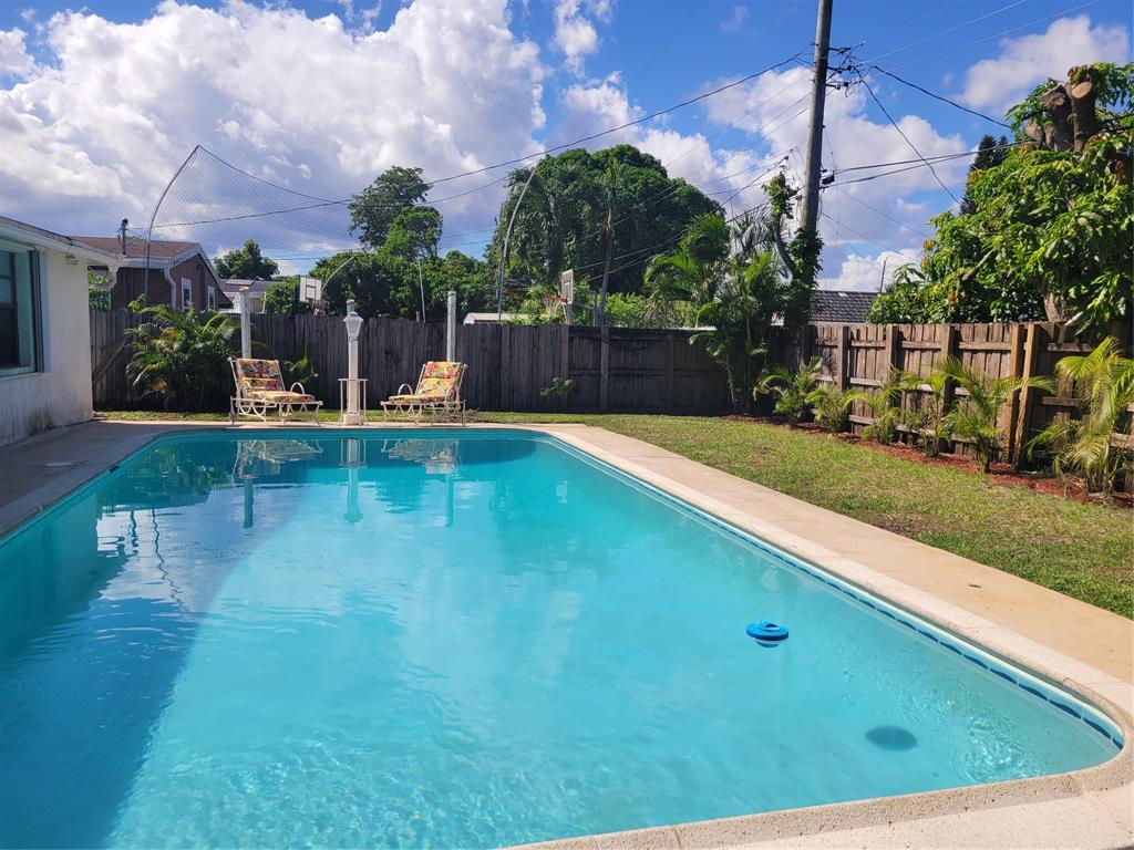 6151 Southwest 2nd Street Margate, FL 33068 - Photo 3 of 4 a view of a swimming pool with a patio