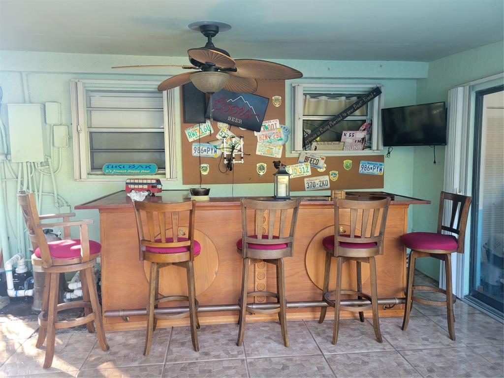 6151 Southwest 2nd Street Margate, FL 33068 - Photo 4 of 4 a dining room with furniture and window
