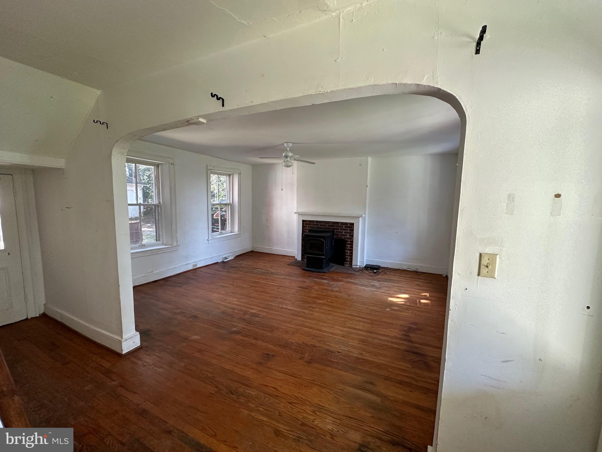 2255 Luther Jones Road Shenandoah Junction, WV 25442 - Photo 11 of 23 a view of empty room with wooden floor and fireplace