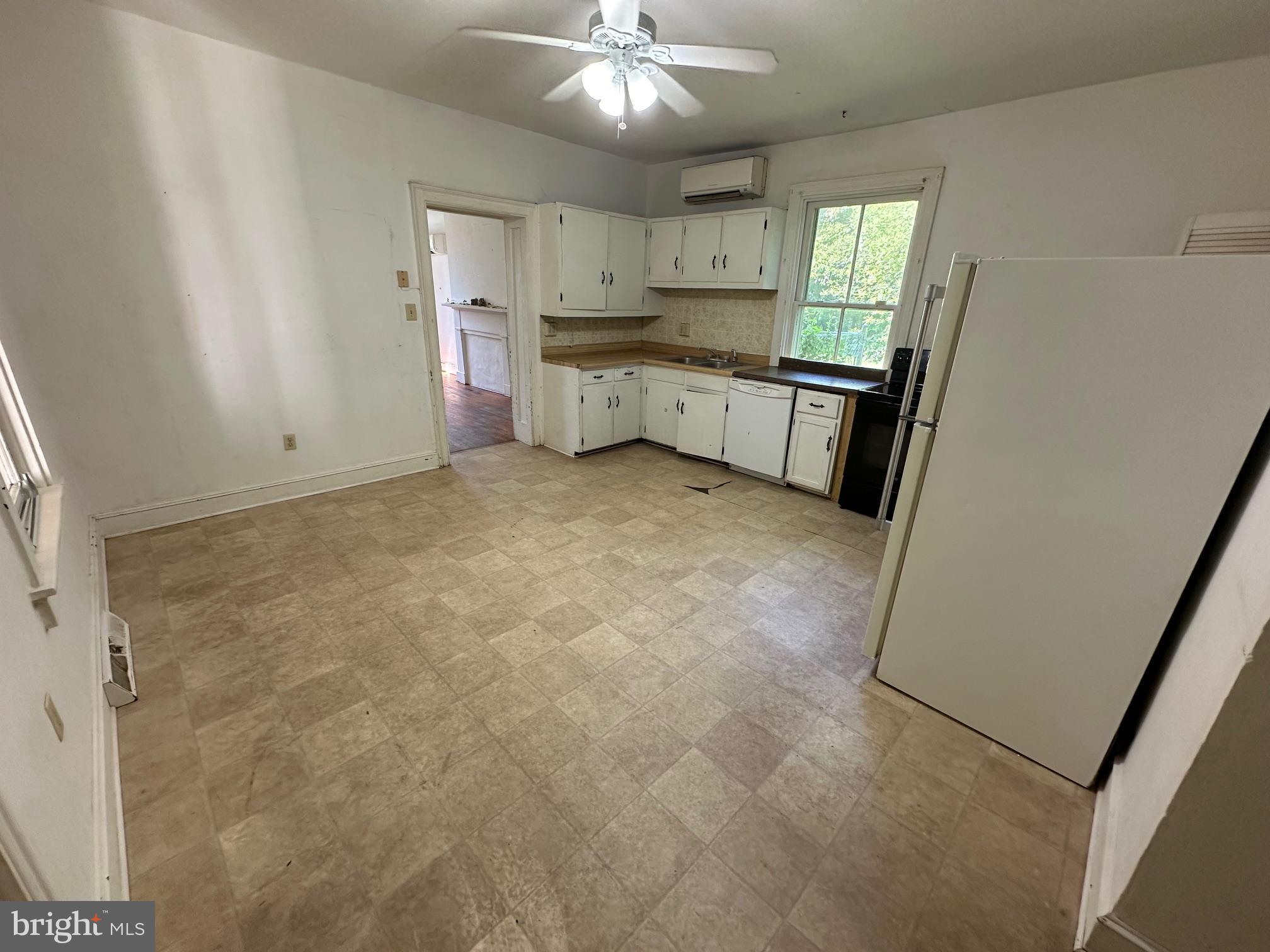 2255 Luther Jones Road Shenandoah Junction, WV 25442 - Photo 13 of 23 a large kitchen with a sink a refrigerator and window