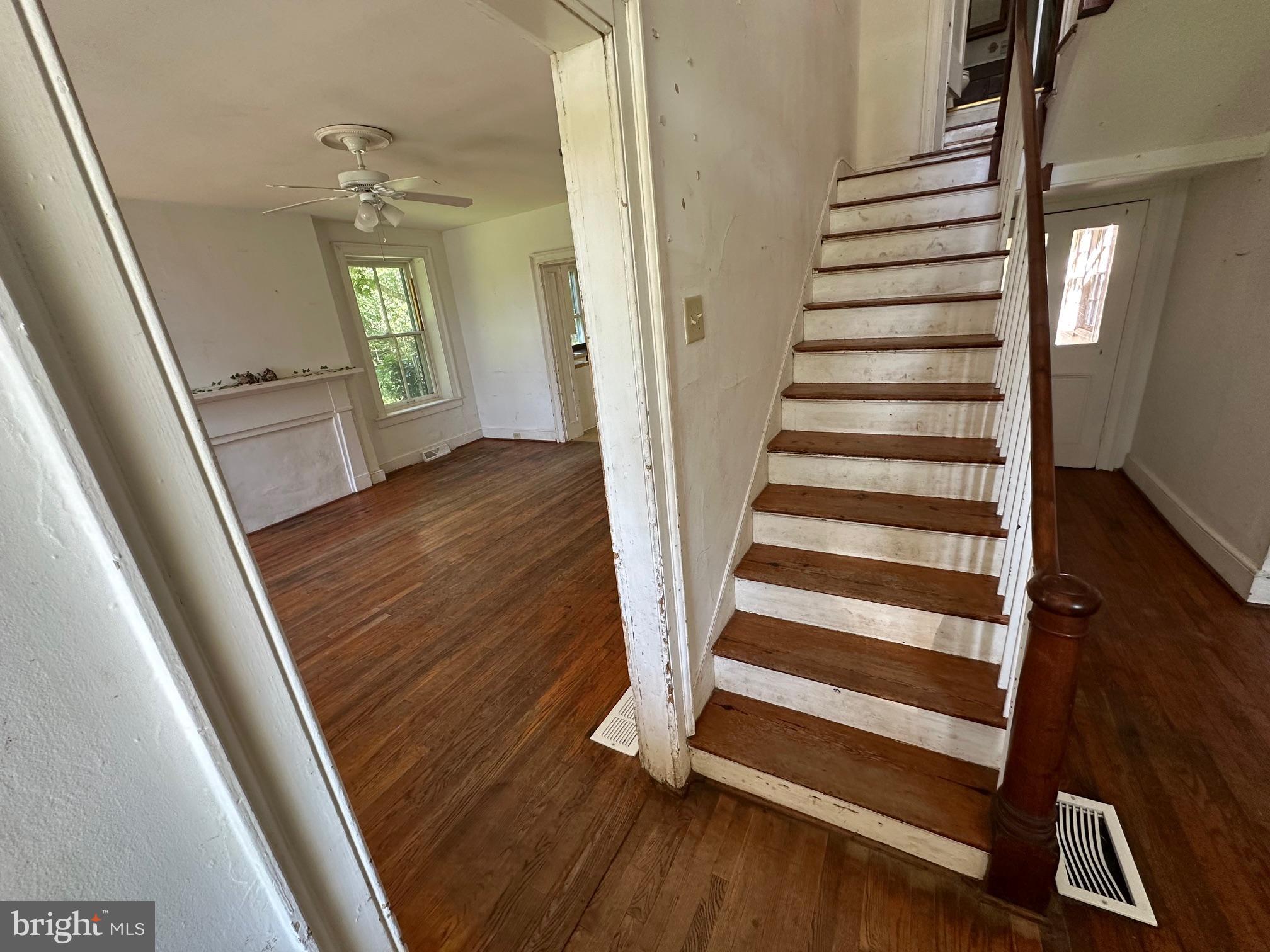 2255 Luther Jones Road Shenandoah Junction, WV 25442 - Photo 15 of 23 a view of a hallway with wooden floor and staircase