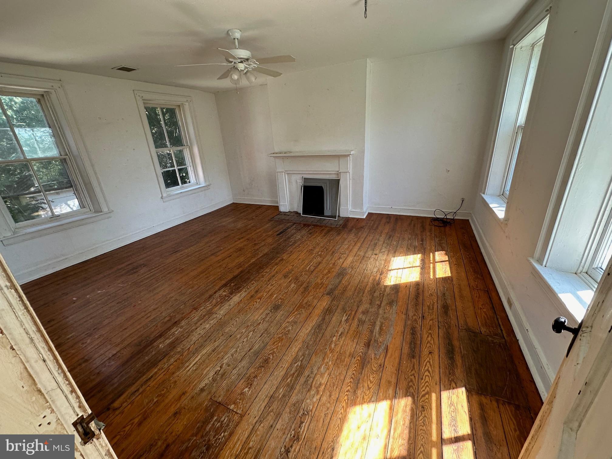 2255 Luther Jones Road Shenandoah Junction, WV 25442 - Photo 17 of 23 wooden floor in an empty room with a window