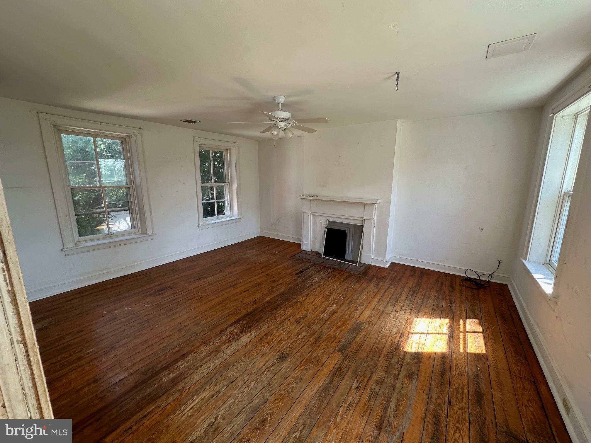 2255 Luther Jones Road Shenandoah Junction, WV 25442 - Photo 18 of 23 a view of empty room with wooden floor and fan