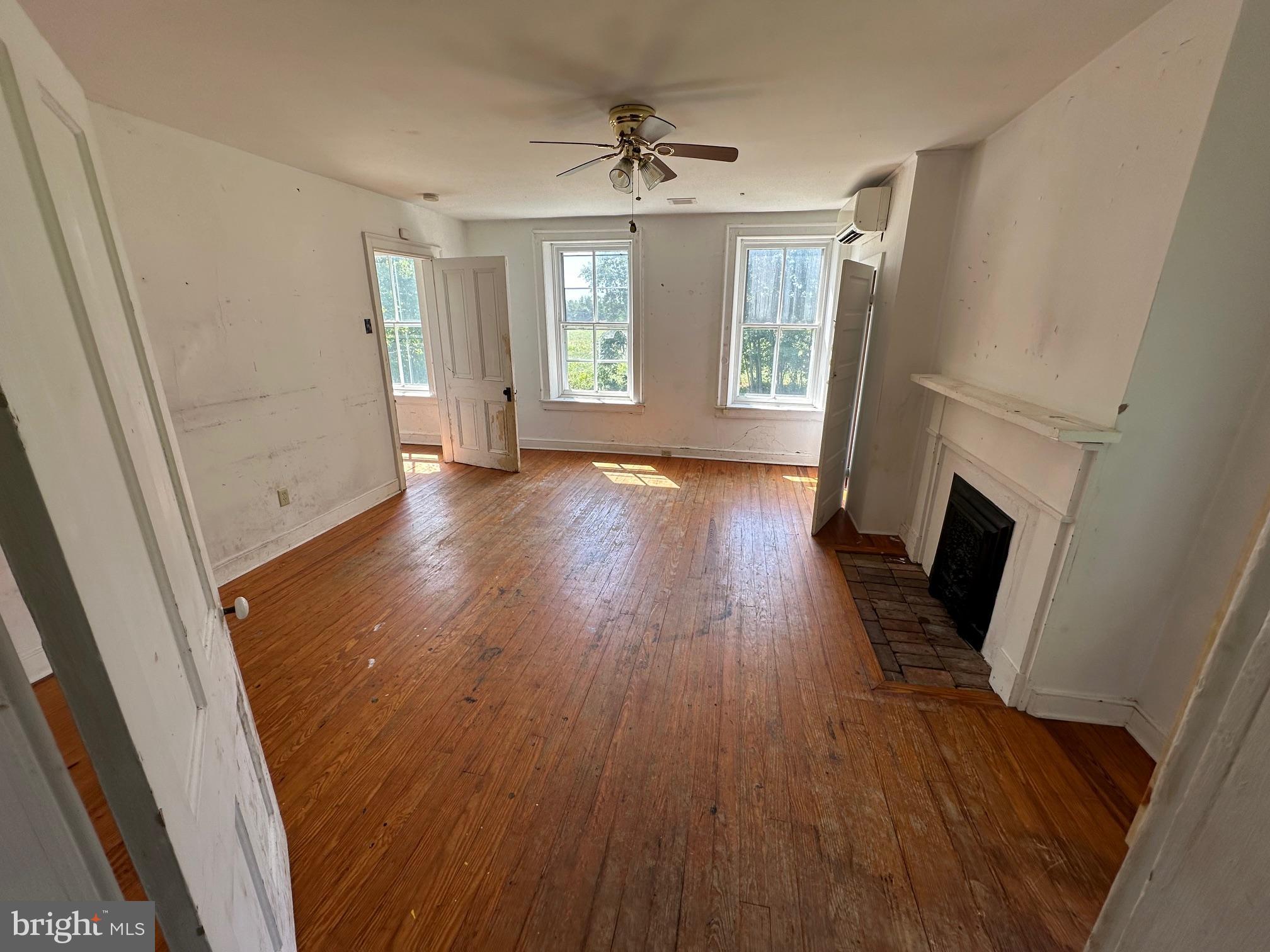 2255 Luther Jones Road Shenandoah Junction, WV 25442 - Photo 19 of 23 an empty room with wooden floor and windows