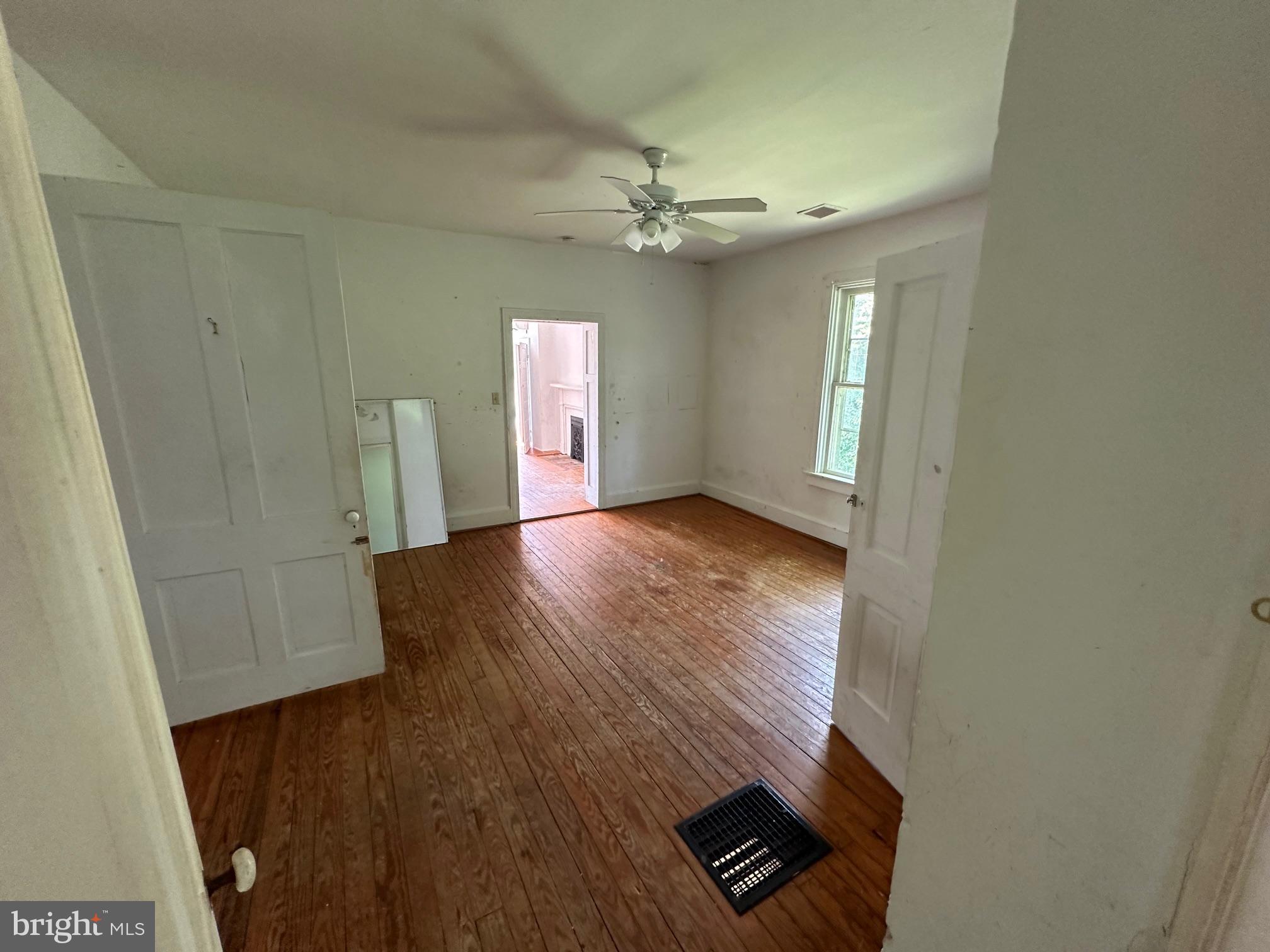 2255 Luther Jones Road Shenandoah Junction, WV 25442 - Photo 20 of 23 wooden floor in an empty room with a window