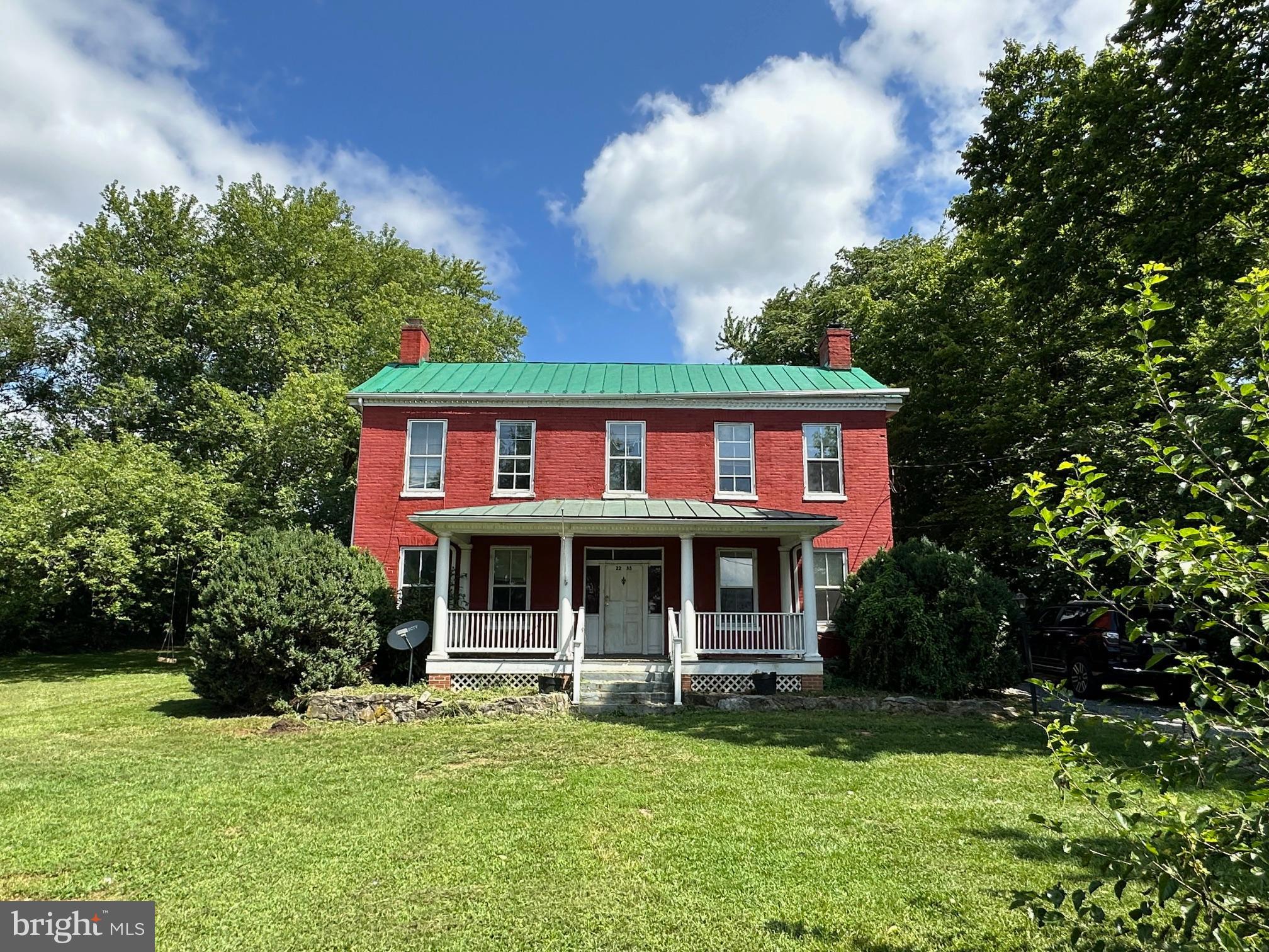 2255 Luther Jones Road Shenandoah Junction, WV 25442 - Photo 3 of 23 a view of a house with a yard plants and large tree