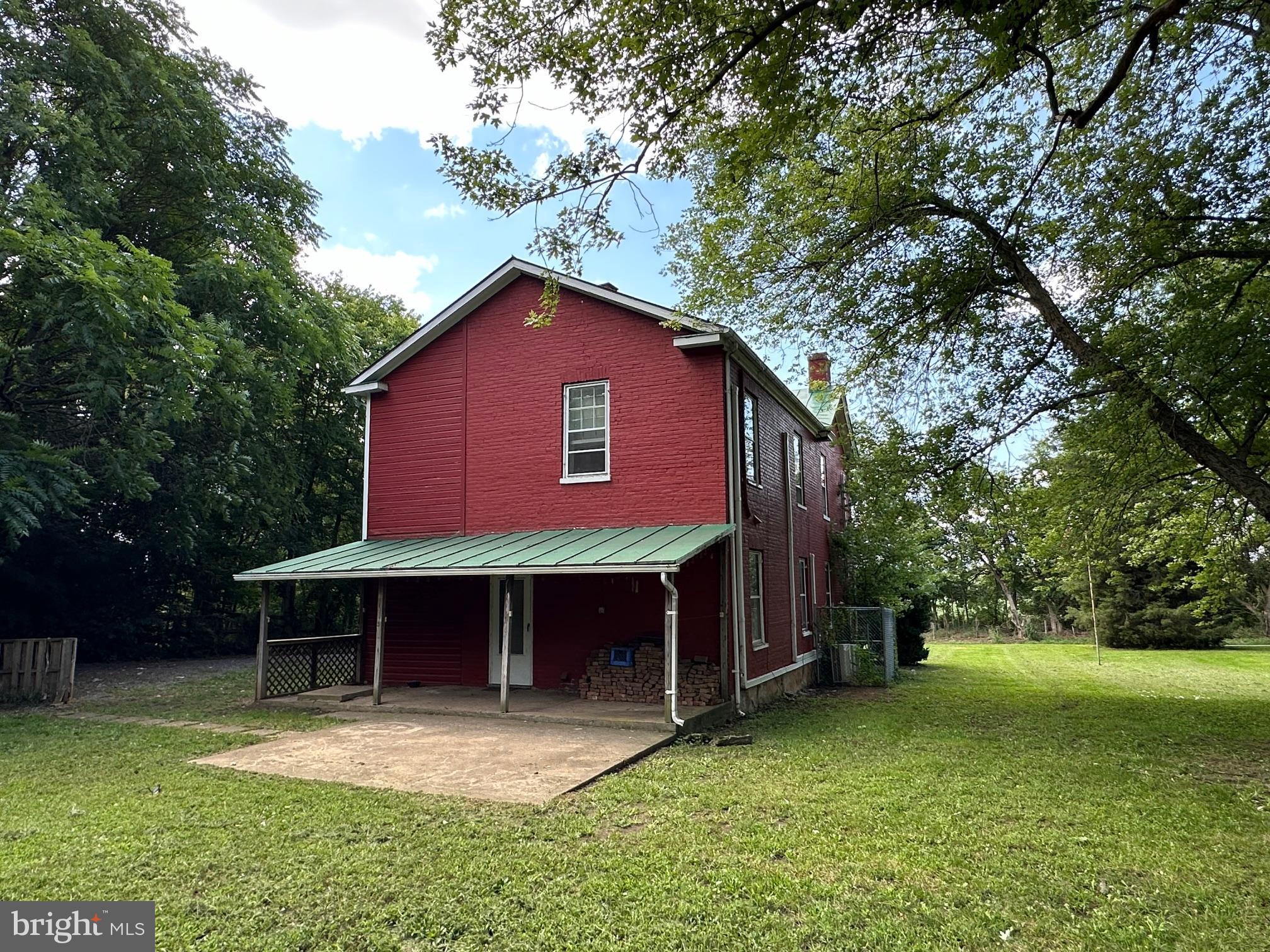 2255 Luther Jones Road Shenandoah Junction, WV 25442 - Photo 6 of 23 a view of a house with a yard potted plants and a large tree