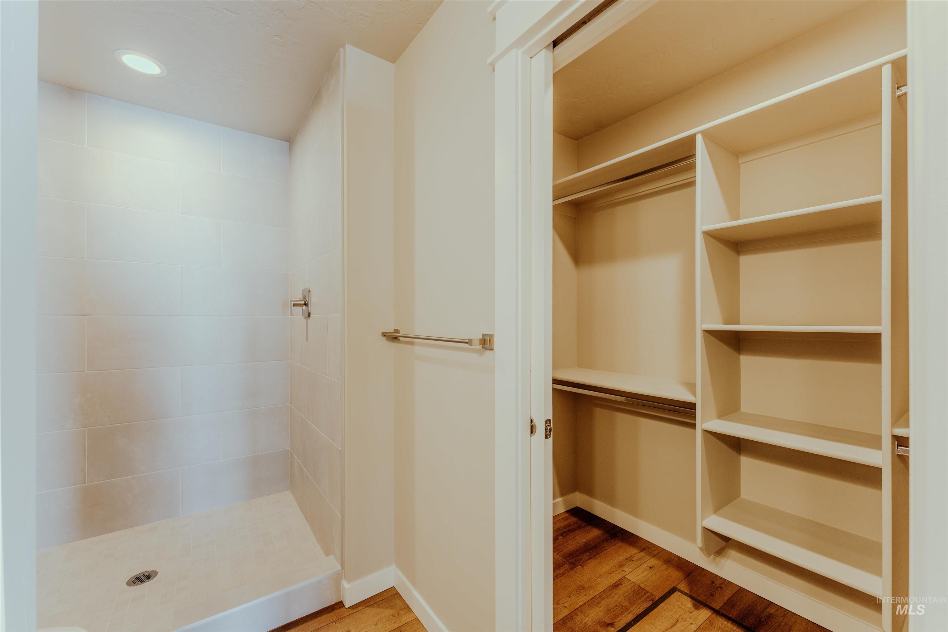 1233 Phillips Circle Ontario, OR 97914 - Photo 13 of 22 Full bath featuring light wood finished floors, a shower stall, and recessed lighting