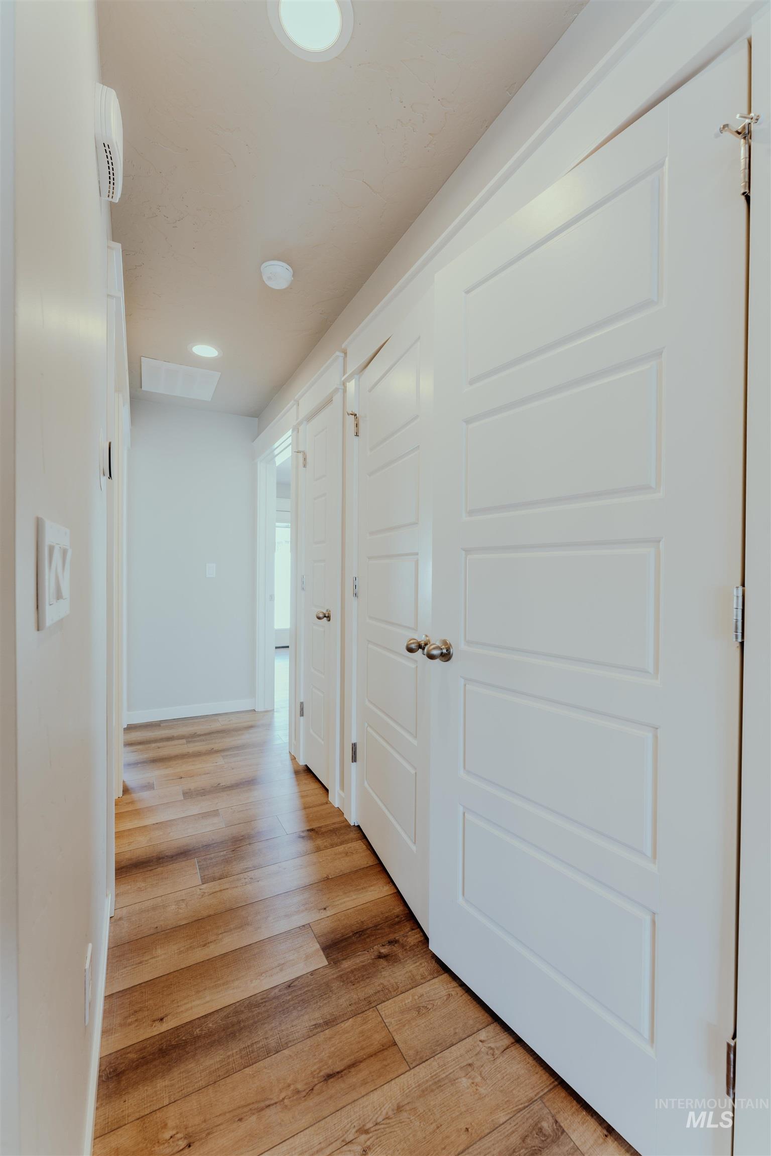 1233 Phillips Circle Ontario, OR 97914 - Photo 7 of 22 Hallway featuring light wood-style flooring and recessed lighting