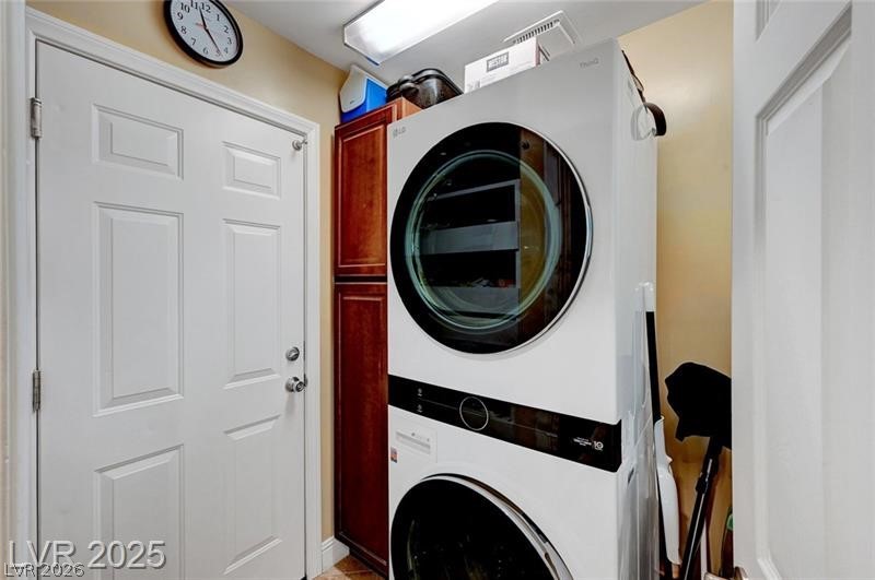 2410 Doherty Way Henderson, NV 89014 - Photo 28 of 63 Clothes washing area with stacked washer / drying machine and cabinet space