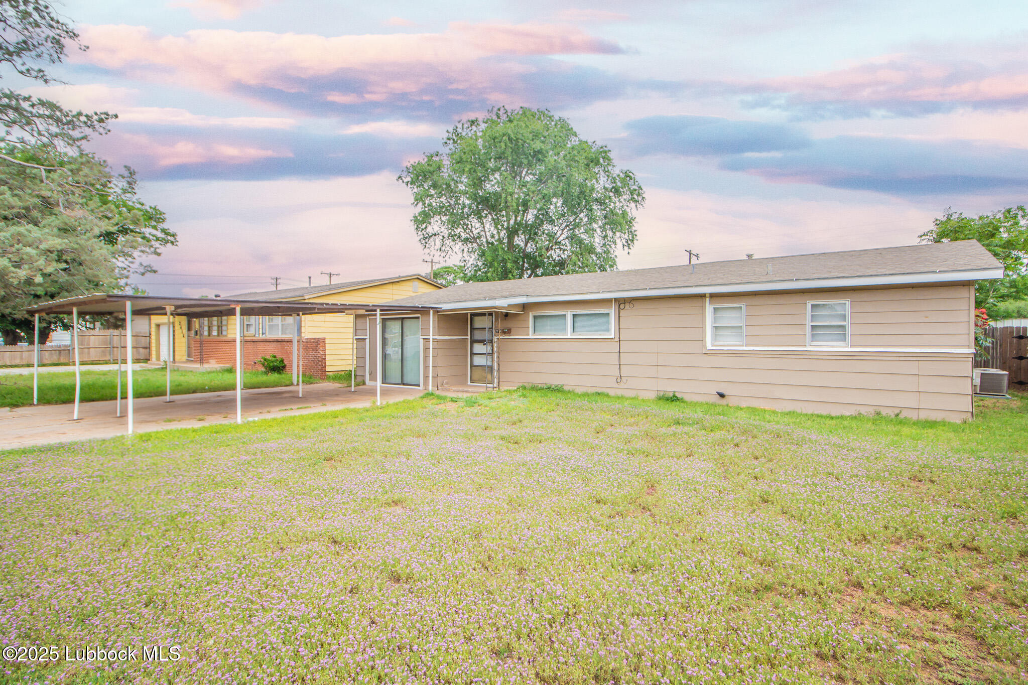 2414 38th Street Lubbock, TX 79412 - Photo 2 of 20 a view of a house with a backyard