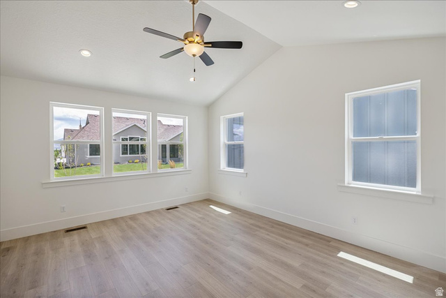 952 Mathilda Drive, Unit 156 Saratoga Springs, UT 84045 - Photo 13 of 25 Main Floor Vaulted Master brass-finish ceiling fan, wood-finish flooring, and multiple windows with white trim