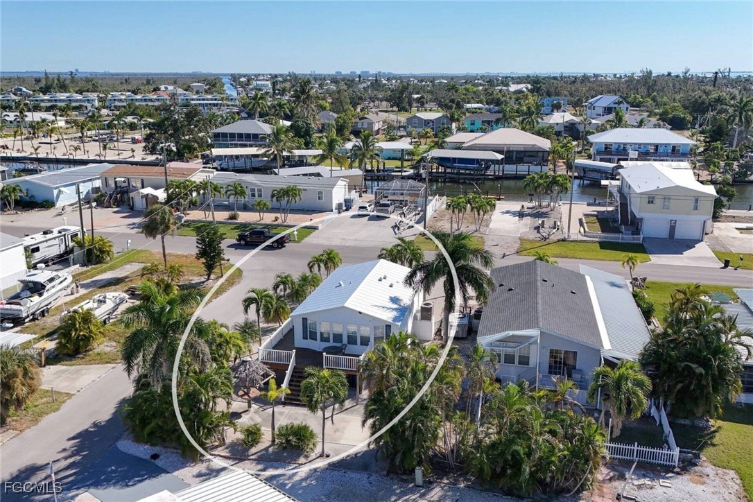 2831 York Road St. James City, FL 33956 - Photo 12 of 29 an aerial view of a house with swimming pool and ocean view