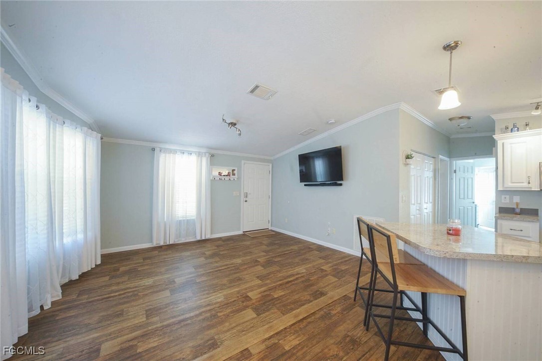 2831 York Road St. James City, FL 33956 - Photo 15 of 29 a view of a livingroom with furniture window and wooden floor